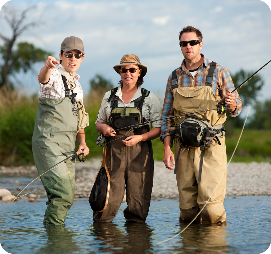 Three people fishing in a river.